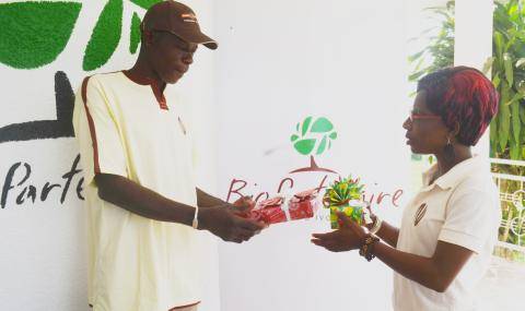 Zallé Alimissi Salame receiving his new mobile phone and solar charger