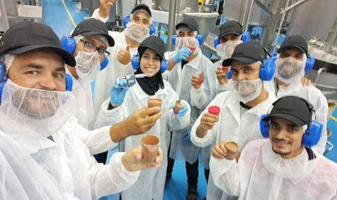 Maximilian Auer (left), Plant Manager with our production team members at the Casablanca chocolate and compound factory following the first batch of production this year.