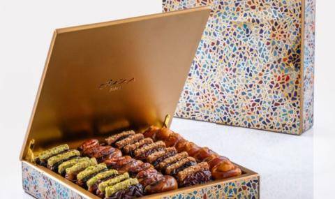 Bateel Oasis gift set small organic plain and filled dates, alongside indulgent chocolates