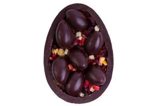 Vegan dark chocolate half egg with a various vegan filling and sprinkles