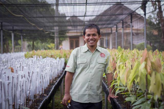 Barry Callebaut employee Sarono at cocoa nursery